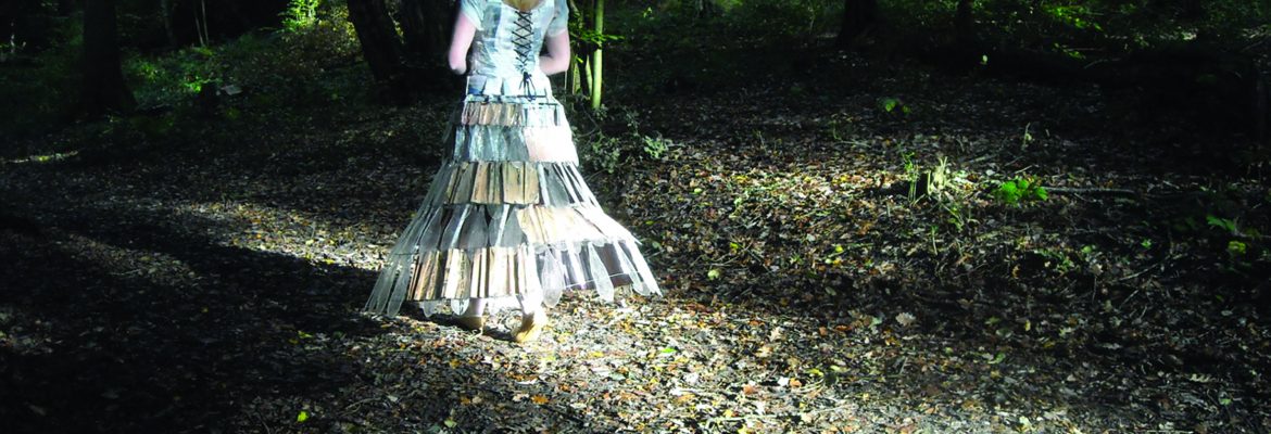 She wander/wonders film directed by Davina Kirkpatrick, music by Sam Hardaker, cameras Ryan Sharp, Mark Guthrie, . A woman in a glass dress walks the paths of the glory wood Dorking and Prussia Cove Cornwall. An embodiment of grief and loss