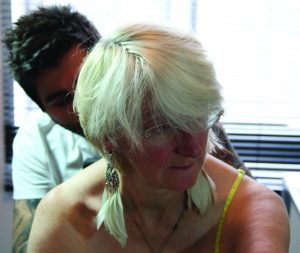 Davina Kirkpatrick being tattooed by Radu Rusu