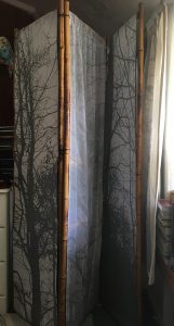 finished screen with silver printed trees on fabric and paper