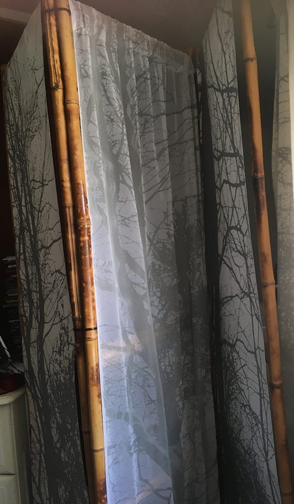 finished screen with silver printed trees on fabric and paper