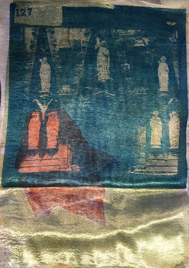 yellow, blue and red heat transfer printing on fabric of statutory at Exeter catherdral.