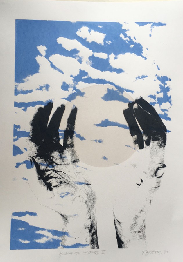 Screen print - large B&W cupped hands surround a floating circle with simplified Cornish clouds in background