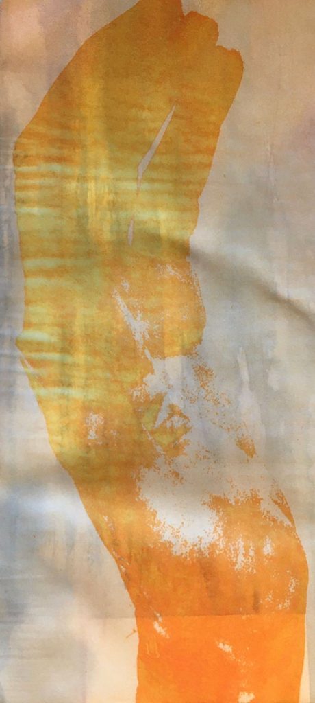 golden heat transfer print on fabric of a cupped hand viewed from the side.