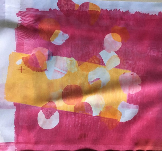 heat transfer print on fabric pink and gold background with silhouettes of rose petals.