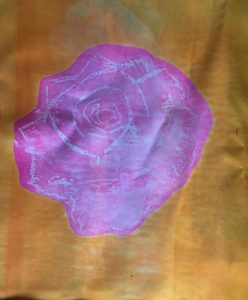 heat transfer print gold background with rose printed in centre.