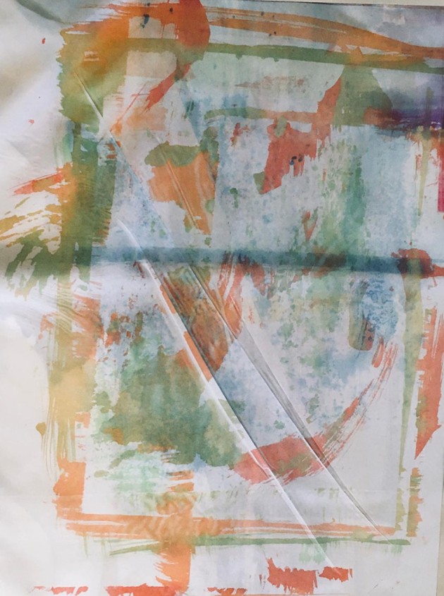 heat transfer print on fabric green and orange border lines and orange and red brush marks.